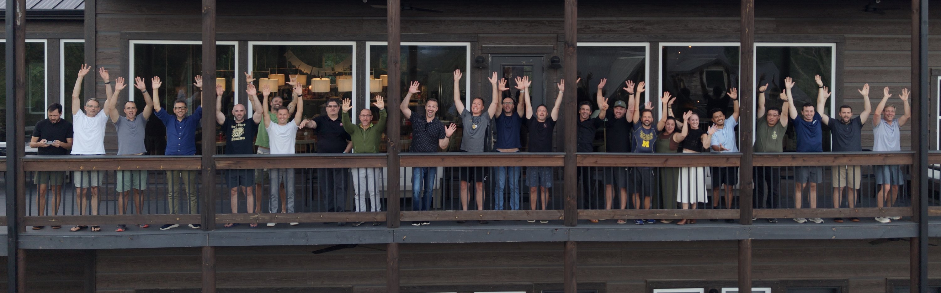 The whole Inner Circle group waving from the cabin balcony